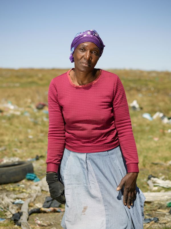 © Anton Bossenbroek - Nomsa picking recyclable goods at Embalenhle township, 2024