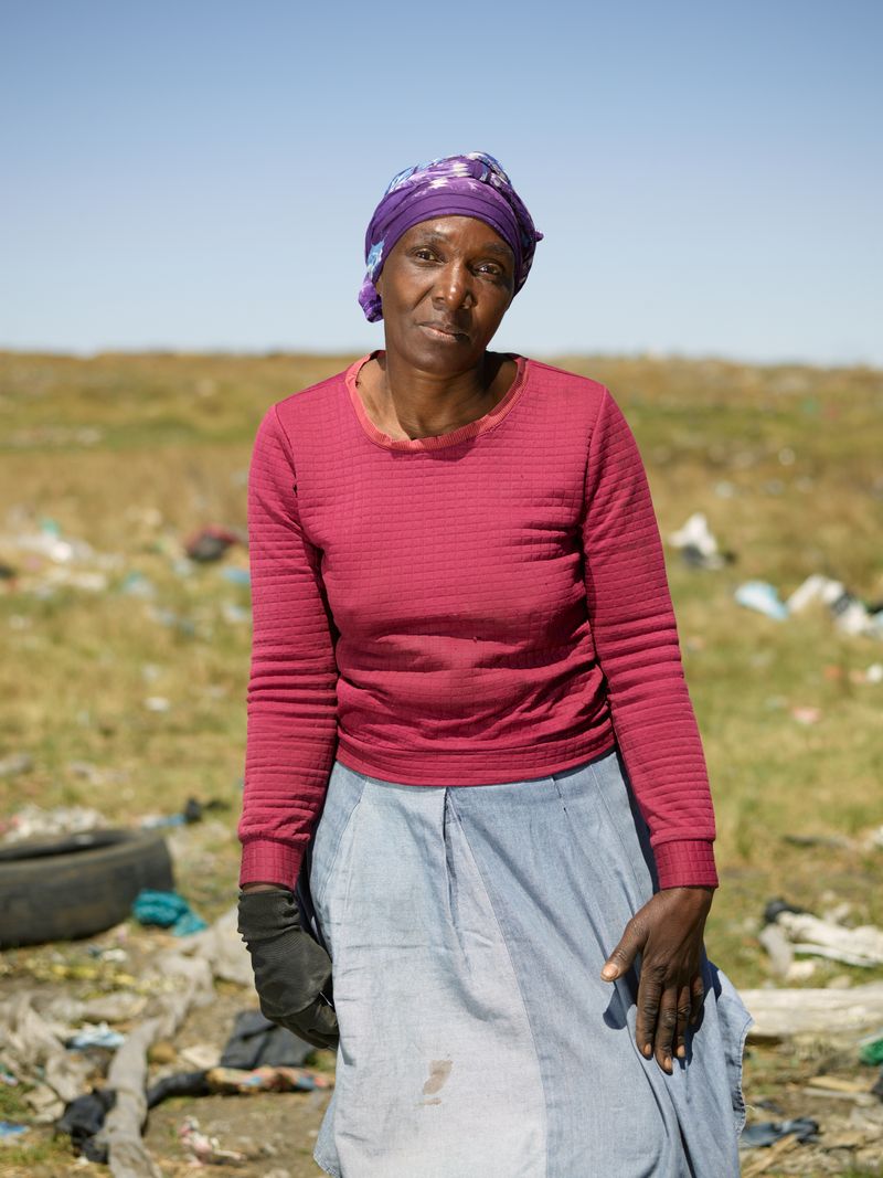 © Anton Bossenbroek - Nomsa picking recyclable goods at Embalenhle township, 2024