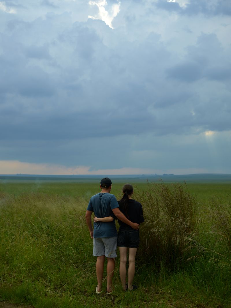 © Anton Bossenbroek - Diewaan and Kiara looking out onto the veld under which the mines of SASOL lay, Secunda, 2025