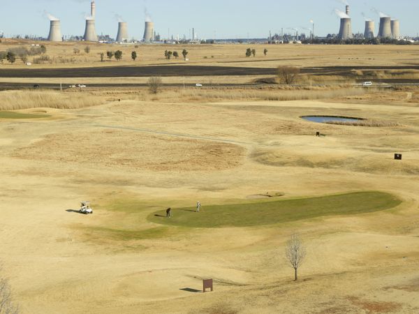 © Anton Bossenbroek - View on SASOL Secunda plant with Graceland's green, 2024