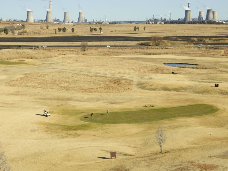 © Anton Bossenbroek - View on SASOL Secunda plant with Graceland's green, 2024