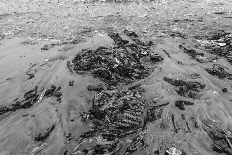 © Natalija Gormalova - Accra’s coastline, choked with textile and plastic waste—pollution Ghanaians did not create but must endure.