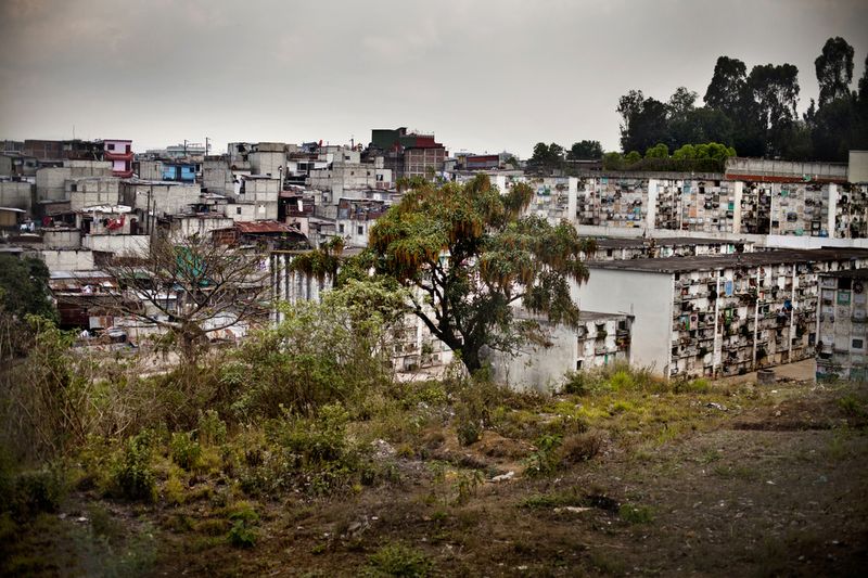 © Lianne Milton - The colony of La Verbena merges with the cemetery, in Zone 7, Guatemala City, on Thursday, April 12, 2012.