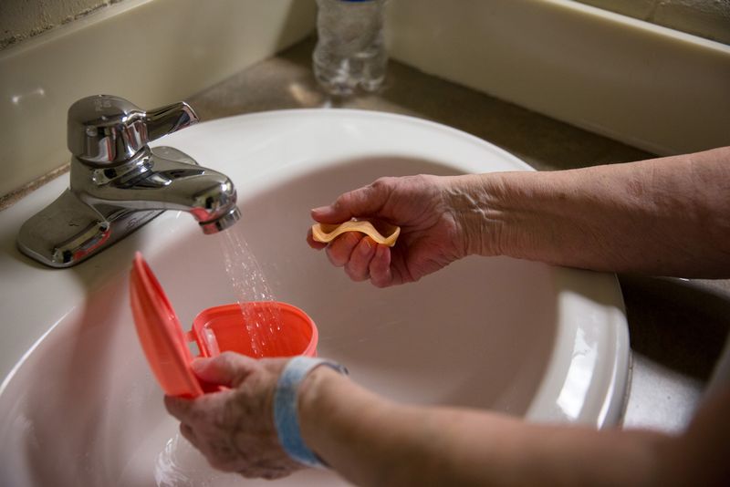 © Jessica Earnshaw - Norma cleans her teeth after breakfast.