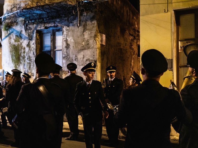 © Sebastian Wells - Members of the Corpo Musicale make a break during a parade. Augusta, November 2019.