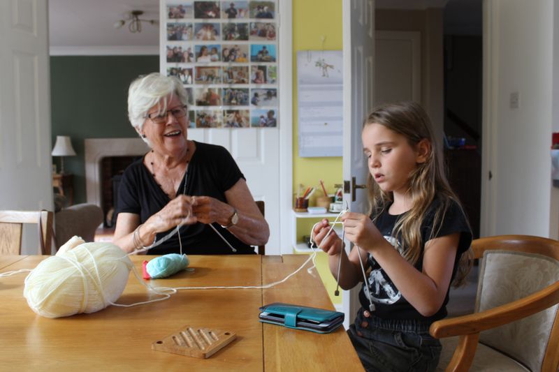 © Ira Sozanska - Learning to knit in peaceNadia sits beside her host Jenny in the UK, learning how to knit. Her first moment of stillness.