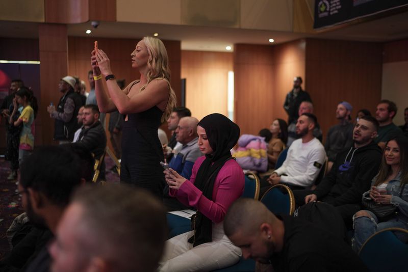 © Daniela Rivera Antara - Tina Rahimi and Kaye Scott watching an amateur fight, supporting atheletes they train with