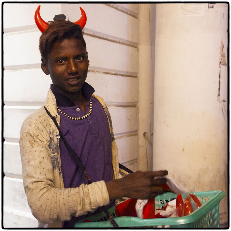 © Vijay S. Jodha - Teenager selling caps and horns.