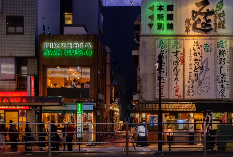 © Vincent Dupont-Blackshaw - Neon lights up the street after dark in Tokyo.