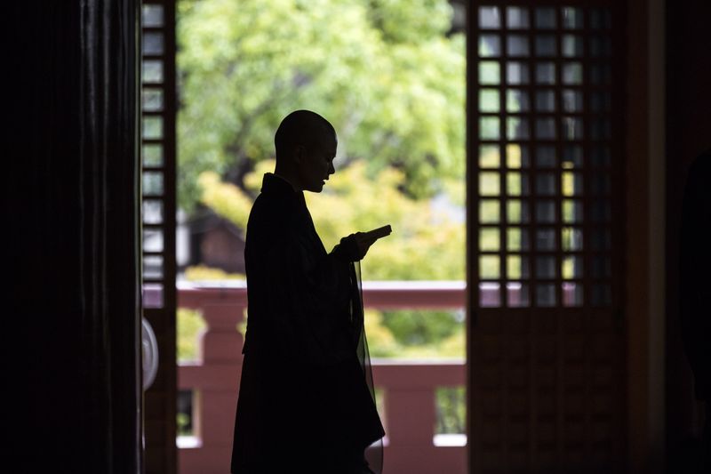 © Hiroko Masuike - Masako chants sutra during a training at the main building inside Chishakuin Temple in Kyoto, September 6, 2018.