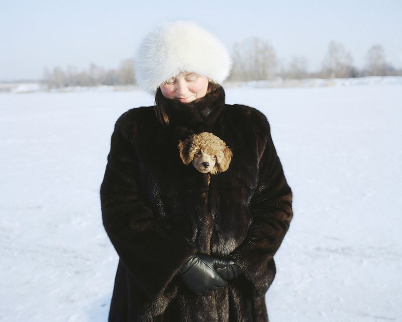 © Andrejs Strokins - Olga with her dog on frozen Buļļupe river, 2012