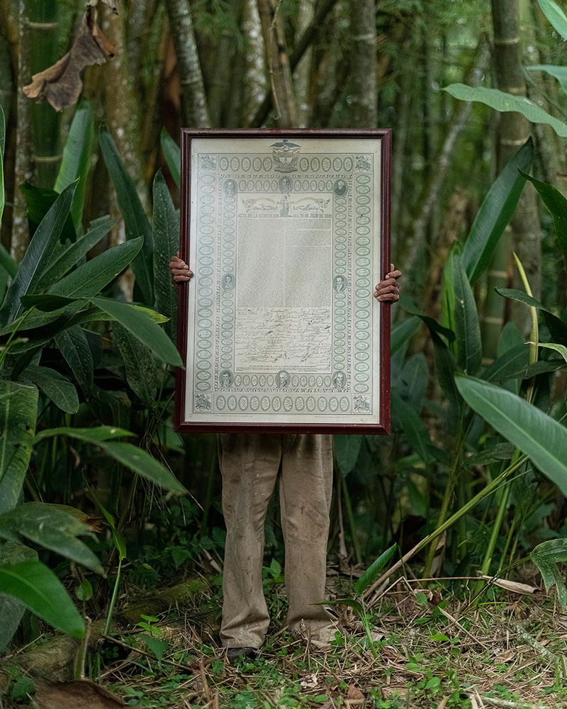 © Margarita V Beltran - A farmer holds a framed copy of the 1810 revolutionary act of Colombia in Norte de Santander, Colombia.