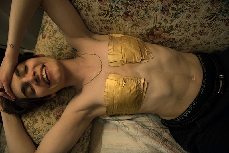 © Maria Giulia Trombini - Nico is wearing his golden tape. Nico’s house. Bologna, May 2021