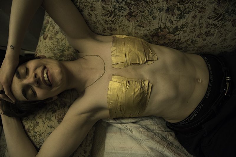 © Maria Giulia Trombini - Nico is wearing his golden tape. Nico’s house. Bologna, May 2021