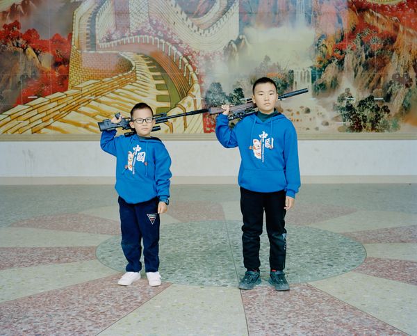 © liang chen - Wang Qiangjie and Wang Weitao are in the village culture building. 2022 Donghai Island, Guangdong Province, China