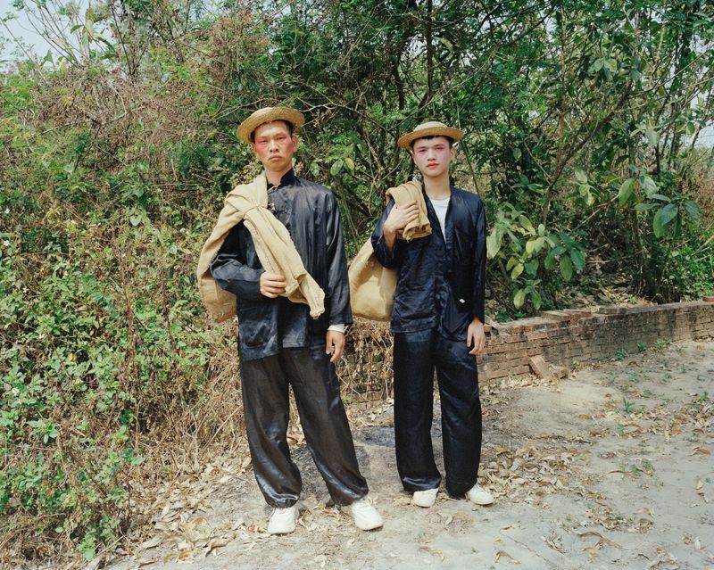 © liang chen - The "landlord" hired workers to collect grain from farmers.  Zhanjiang, Guangdong, China 2023