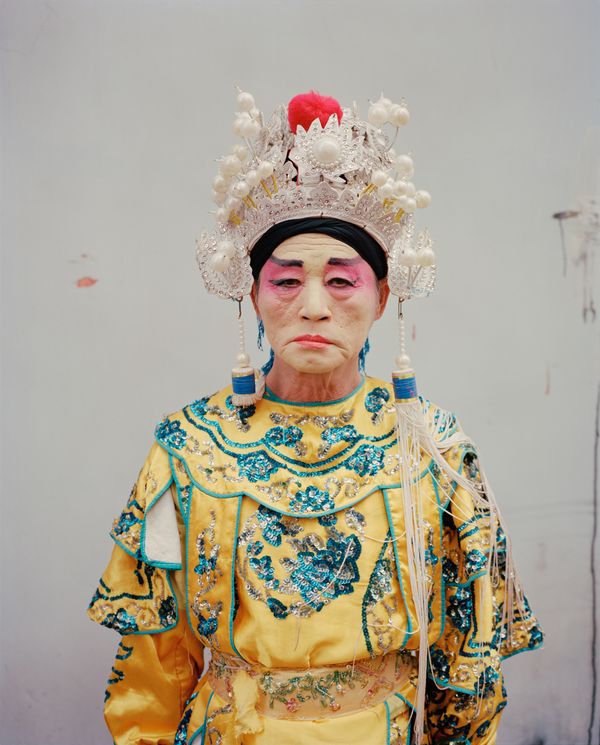 © liang chen - An old man played the role of an ancient Chinese emperor. 2018 Donghai Island, Guangdong, China