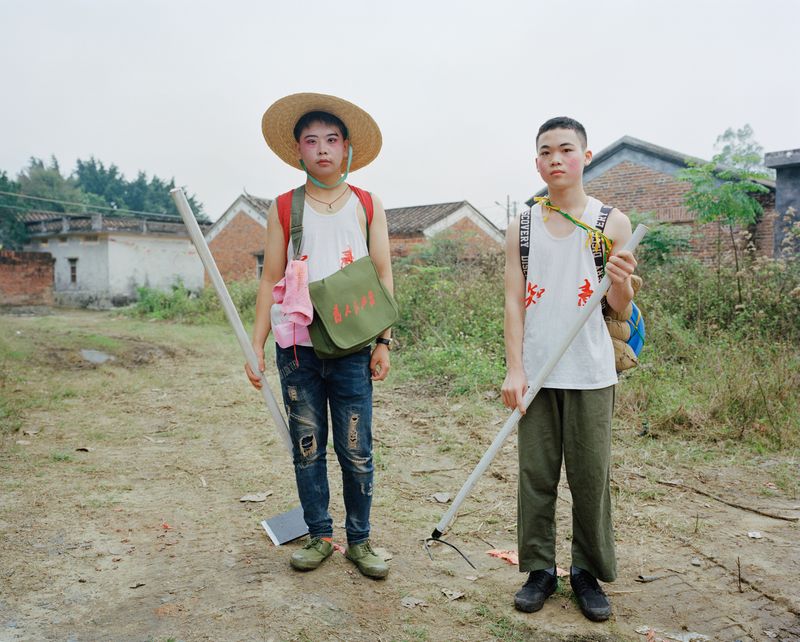© liang chen - Two students play the role of "educated youth" to the countryside.  2023 Leizhou, Guangdong, China