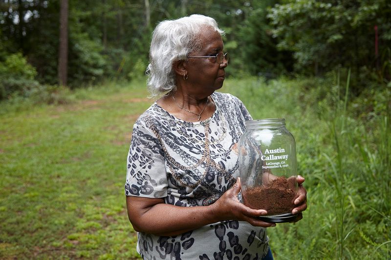 © Richard Ansett - Frances holds the memorial jar as she watches Walter collect soil