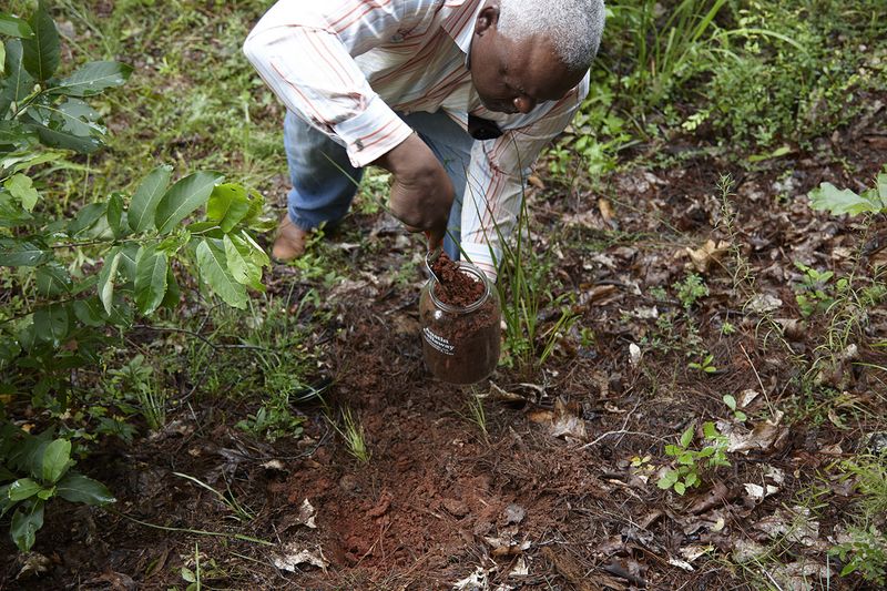 © Richard Ansett - Walter collects soil for the Austin Callaway memorial jar