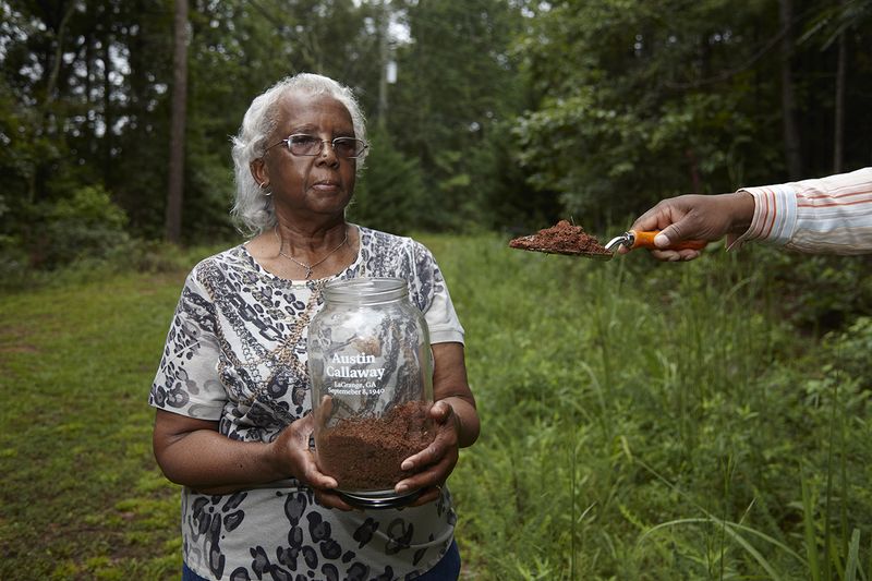 © Richard Ansett - Frances assists Walter in collecting soil for the memorial jar