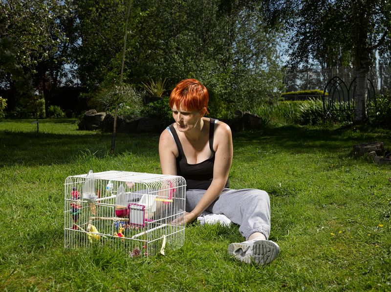 © Richard Ansett - Debbie with Budgerigar