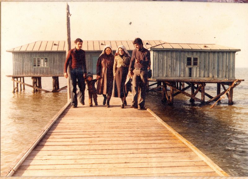 © masoumeh bahrami - An old photo of my parents and brother with their friends who came to the Miankaleh due to have fun and buy fish.