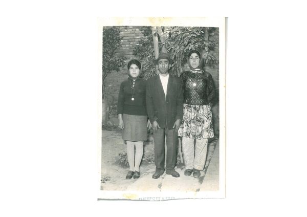 © masoumeh bahrami - This photo shows my mother and my aunt beside my grandfather.