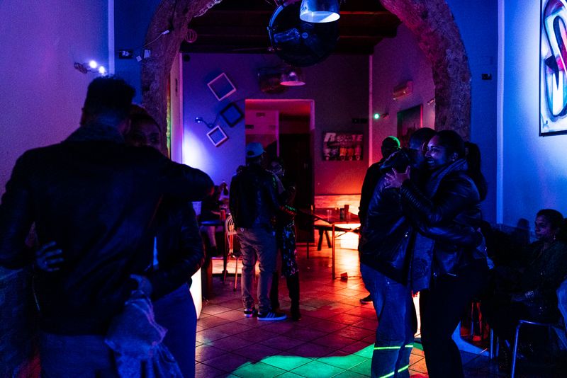 © Giovanni Lo Curto - Vanessa and her boyfriend dancing during a party of the Maurizius community that they organized. Palermo, Italy 2018.