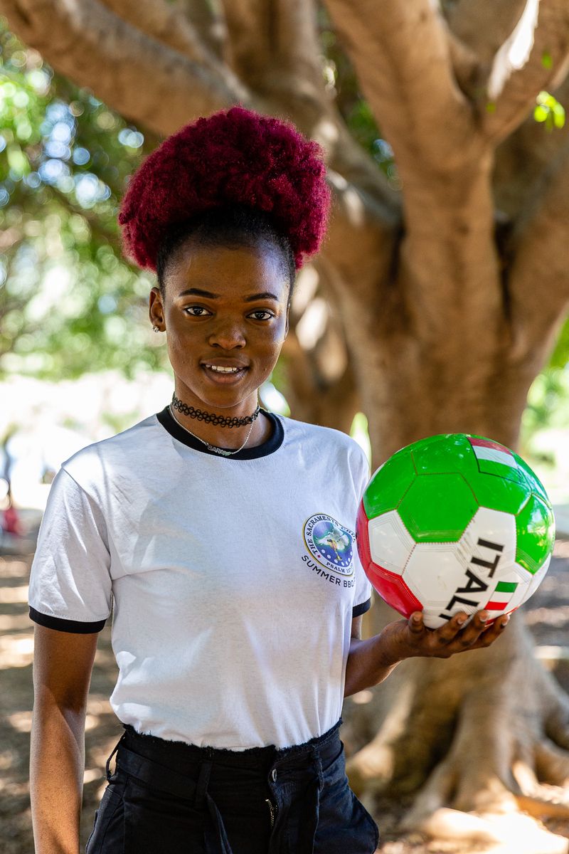 © Giovanni Lo Curto - Sara, one of the members of the Sacraments church, loves to play football. Palermo 2019.
