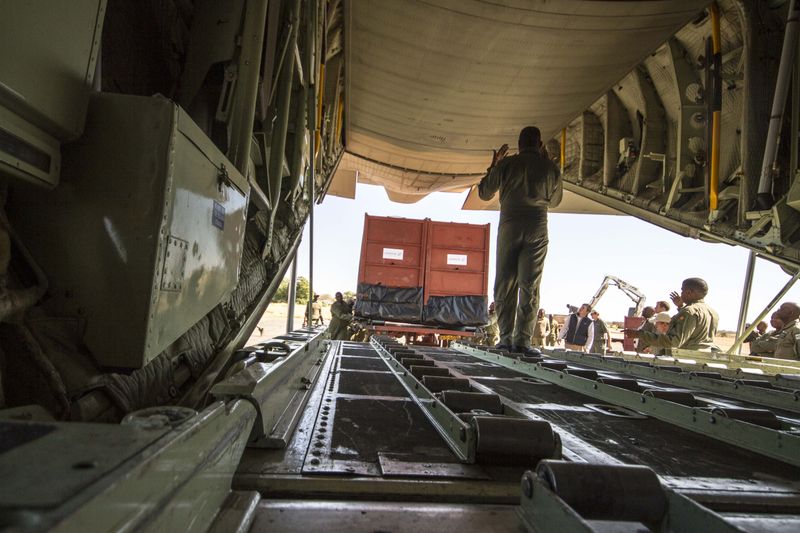© Hilary O'Leary - Loading Rhinos to be translocated by air.