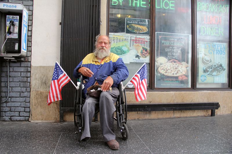 © Julie Grace Immink - Man with two flags