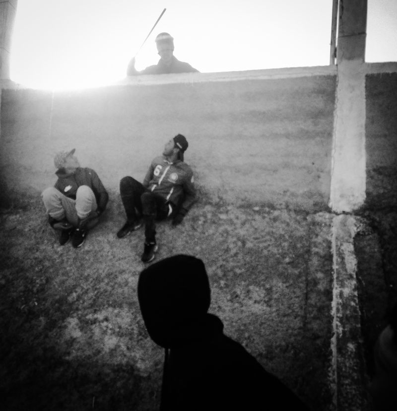 © Fethi Sahraoui - A riot policeman threatening supporters with his stick.