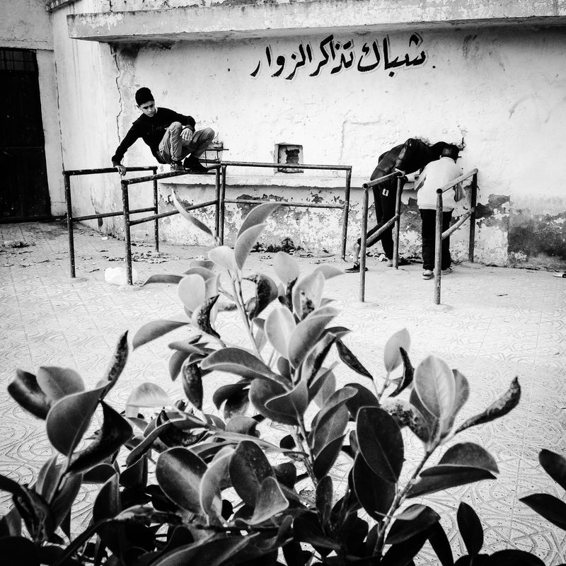 © Fethi Sahraoui - Young children buying tickets in early morning to avoid the rush hours before the match.