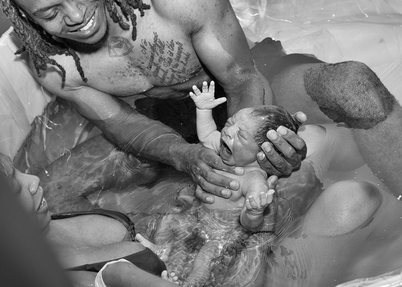 © Maggie Shannon - Shalom Montgomery holds his newborn son for the first time at the New Life Midwifery Birth Center in Arcadia, CA.