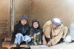 On a Loom of Hope, Under Shadows of Uncertainty, Generations Weave the Fabric of Survival.