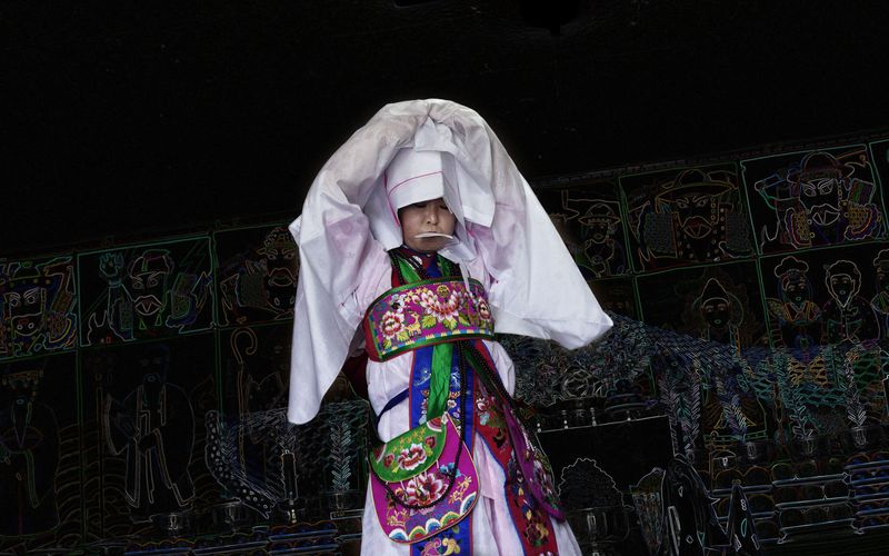 © Flore-aël SURUN - The Mudang Woman officiates a private (ritual) Kut for the happiness of a family.Seoul, South Korea.