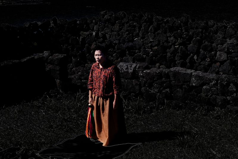 © Flore-aël SURUN - Portrait of the shaman Soonshil SUH, of the Jamsutgut group.Region of Gimnyeong.Isle of Jeju.South Korea.