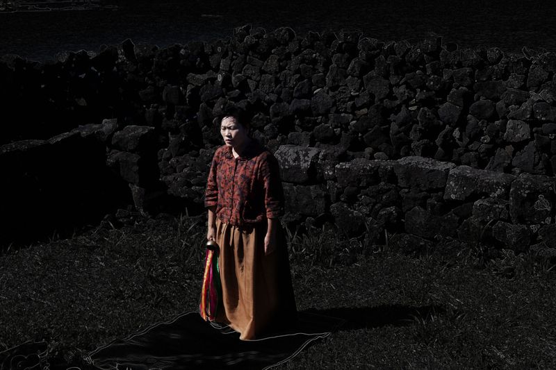 © Flore-aël SURUN - Portrait of the shaman Soonshil SUH, of the Jamsutgut group.Region of Gimnyeong.Isle of Jeju.South Korea.