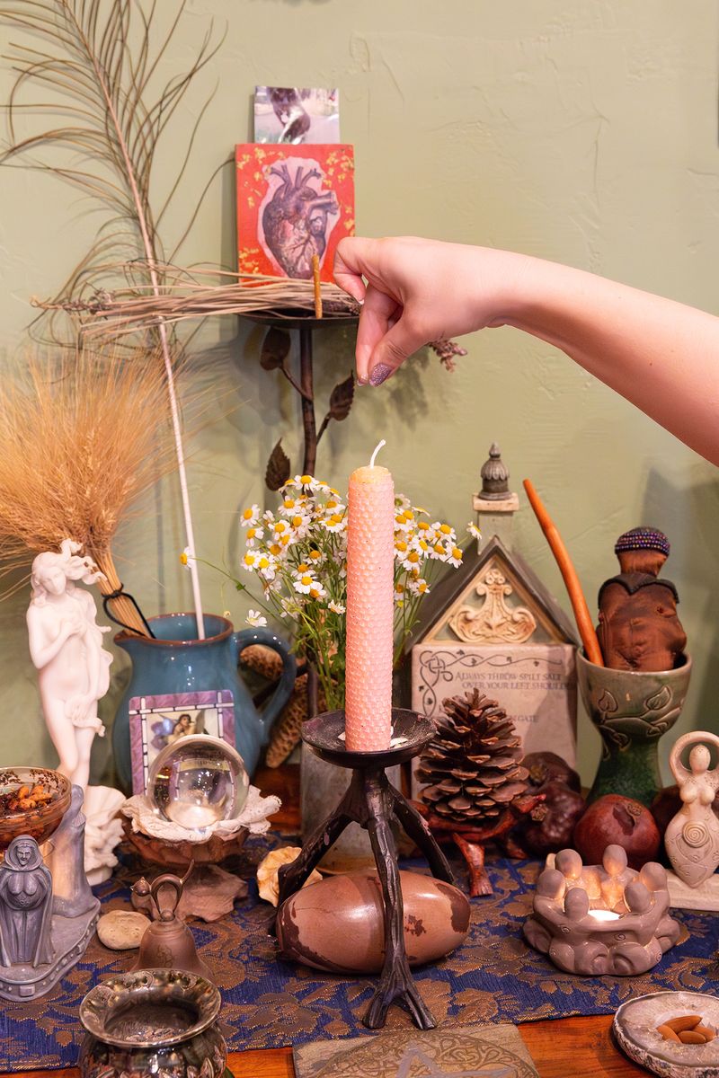 © Allison Stewart - Diana activates a ritual candle for Beltane, San Diego, California. 2024