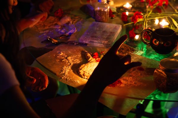 © Allison Stewart - Jasmine adds wax to her conjure clay mermaid, Escondido, California. 2024