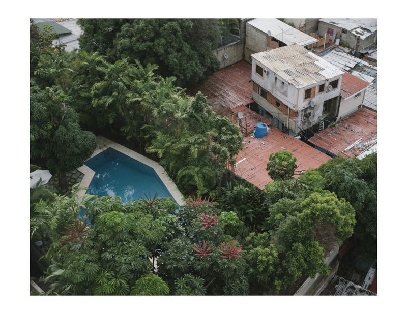 © Andrea Hernández Briceño - The limit between a high income neighborhood and a low income neighborhood in Caracas, Venezuela, on August 3, 2018