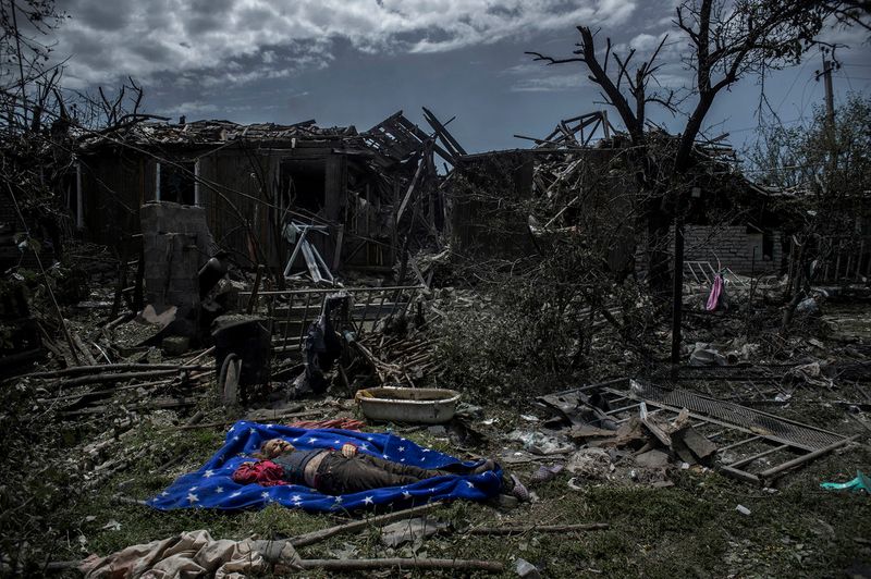 © Valery Melnikov - The local resident killed during an air attack in the Luhanskaya village