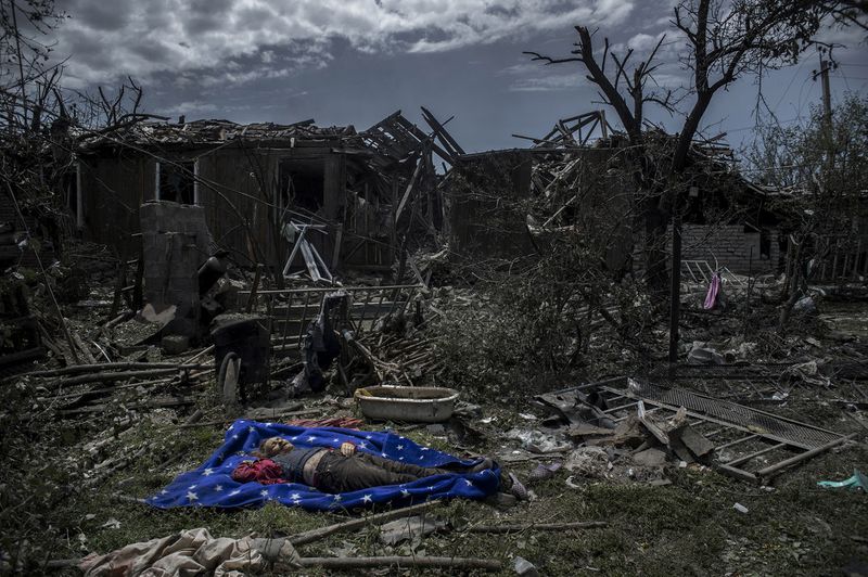 © Valery Melnikov - The local resident killed during an air attack in the Luhanskaya village
