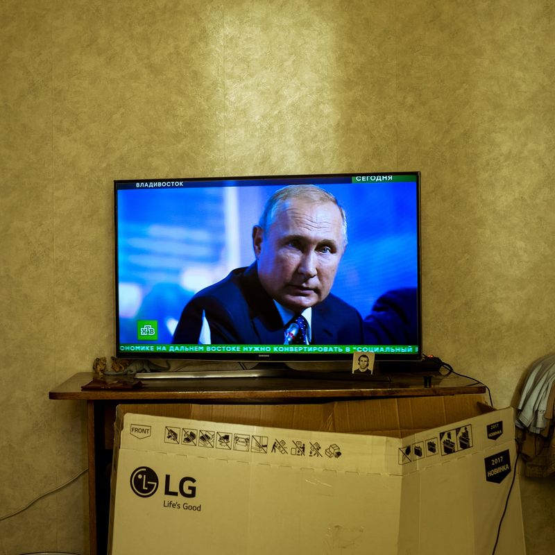 © Maria Quigley - Vladimir Putin on the television screen in Babushka's bedroom. An LG 'Life's Good' TV box leans against the cabinet.