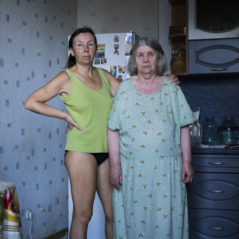 © Maria Quigley - Svetlana and Babushka stand in the kitchen.