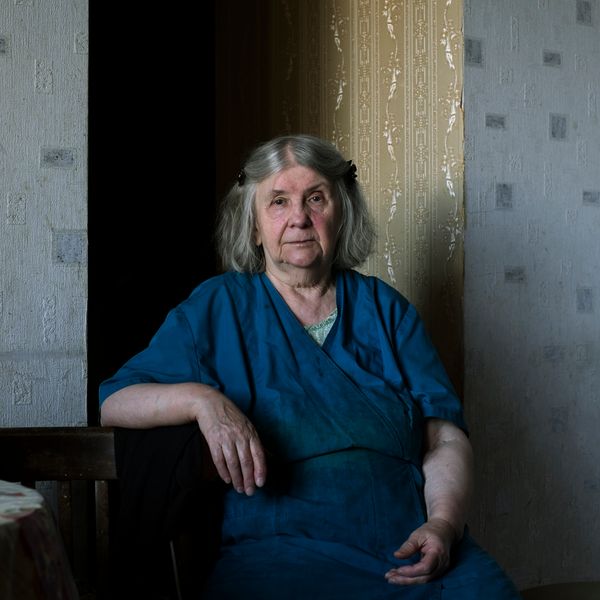 © Maria Quigley - Babushka sits beside the kitchen table.