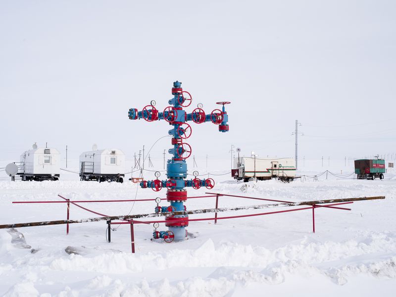 © charles xelot - Gas well ready for exploitation. On the background, worker's housing.