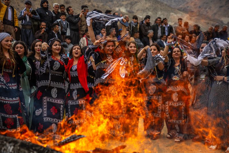 © Farbod Bavehie - Participants gather around the fire and interact during the Nowruz ceremony.