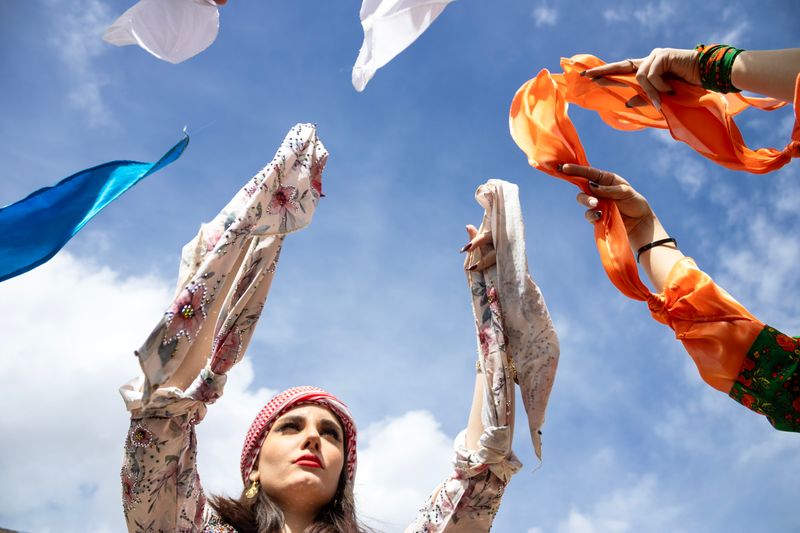 © Farbod Bavehie - Participants raise colorful shawls during the group dance.